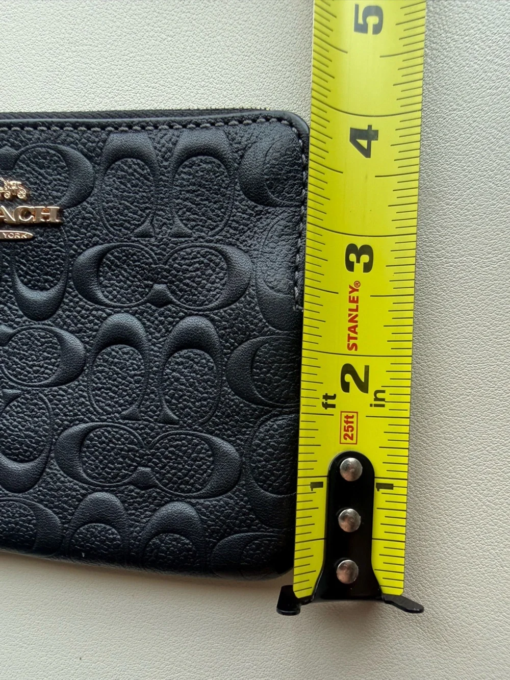 Coach Black Embossed Signature Wristlet with Gold Logo